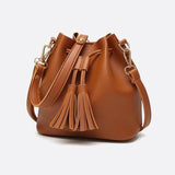 Camel Leather Bucket Bag with Tassels – Chic, Compact & Versatile - in Classic Brown | Arvea Bags