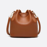 Camel Leather Bucket Bag with Tassels – Chic, Compact & Versatile - in Classic Brown | Arvea Bags