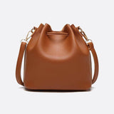 Camel Leather Bucket Bag with Tassels – Chic, Compact & Versatile - in Classic Brown | Arvea Bags