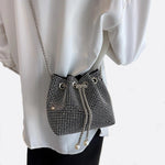 Drawstring bucket bag with rhinestones and chain strap - in Silver | Arvea Bags