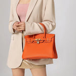 Elegant Designer Satchel Bag – Genuine Leather Handbag with Scarf - Wrapped Handle & Gold Hardware - in Orange | Arvea Bags