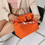 Elegant Designer Satchel Bag – Genuine Leather Handbag with Scarf - Wrapped Handle & Gold Hardware - in Orange | Arvea Bags