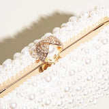Elegant Pearl Clutch Bag – Designer - Inspired Evening Handbag with Gem Clasp & Gold Chain Description: - in Pearl White | Arvea Bags