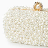 Elegant Pearl Clutch Bag – Designer - Inspired Evening Handbag with Gem Clasp & Gold Chain Description: - in Pearl White | Arvea Bags