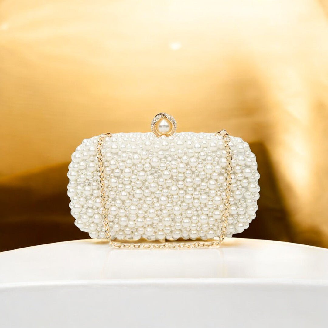 Elegant Pearl Clutch Bag – Designer - Inspired Evening Handbag with Gem Clasp & Gold Chain Description: - in Pearl White | Arvea Bags