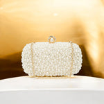 Elegant Pearl Clutch Bag – Designer - Inspired Evening Handbag with Gem Clasp & Gold Chain Description: - in Pearl White | Arvea Bags