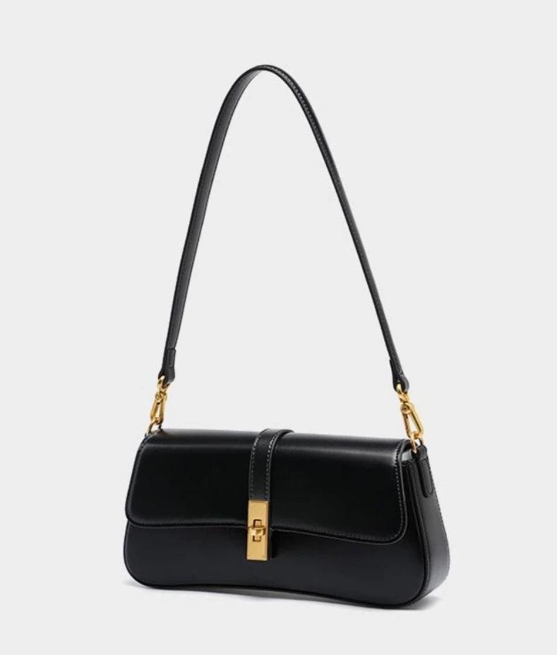Éloise | Sleek Leather Baguette Bag – Detachable Strap & Gold - Tone Lock - in Brown | Arvea Bags
