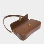 Éloise | Sleek Leather Baguette Bag – Detachable Strap & Gold - Tone Lock - in Brown | Arvea Bags