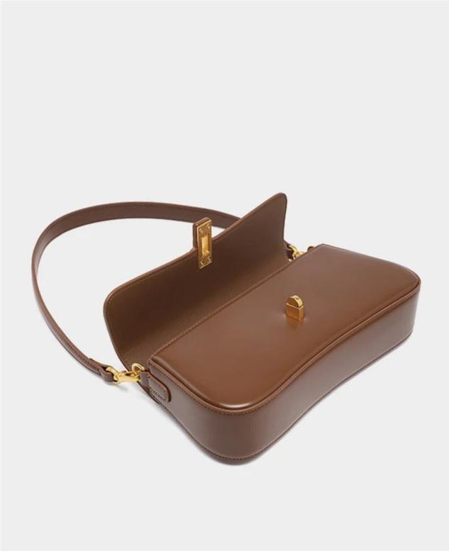 Éloise | Sleek Leather Baguette Bag – Detachable Strap & Gold - Tone Lock - in Brown | Arvea Bags