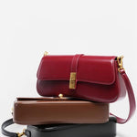 Éloise | Sleek Leather Baguette Bag – Detachable Strap & Gold - Tone Lock - in Burgundy | Arvea Bags