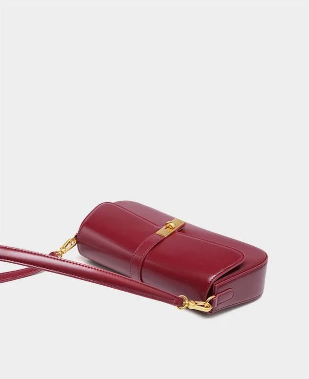 Éloise | Sleek Leather Baguette Bag – Detachable Strap & Gold - Tone Lock - in Burgundy | Arvea Bags