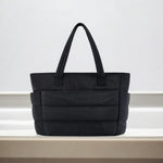 Large black padded puffer tote – stylish quilted handbag with top handles - in Black | Arvea Bags