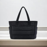 Large black padded puffer tote – stylish quilted handbag with top handles - in Black | Arvea Bags