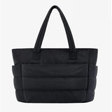 Large black padded puffer tote – stylish quilted handbag with top handles - in Black | Arvea Bags