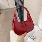 Lumi | Patent Leather Mini Hobo Bag – Glossy Finish & Curved Silhouette - in Red | Arvea Bags