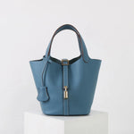 Minimalist Leather Bucket Bag – Small Structured Tote with Gold Padlock Detail - in Baby blue | Arvea Bags