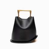 Modern Sculptural Leather Handbag – Minimalist Design with Gold Handle - in Black | Arvea Bags