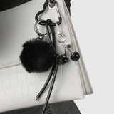 Praelia | Black Pom - Pom Heart Charm – Chic, Modern & Playful - in Black | Arvea Bags