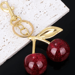 Ruby | Glitter Cherry Gold Keychain – Sparkling Elegance - in Bordeaux red | Arvea Bags
