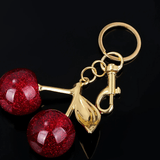 Ruby | Glitter Cherry Gold Keychain – Sparkling Elegance - in Bordeaux red | Arvea Bags