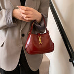 Sofie Saddle Bag – Glossy Burgundy Vegan Leather Shoulder Bag - in Red | Arvea Bags