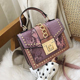Statement Messenger Bag with Chain Detail and Python Texture - in Salmon Pink | Arvea Bags