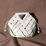Unique Woven Leather Crossbody Bag – Distinctive Triangle Handle & Bucket Style - in Racing Green | Arvea Bags